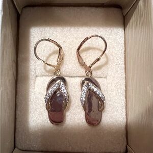 Gold tone flip flop lever back earrings with clear rhinestones.